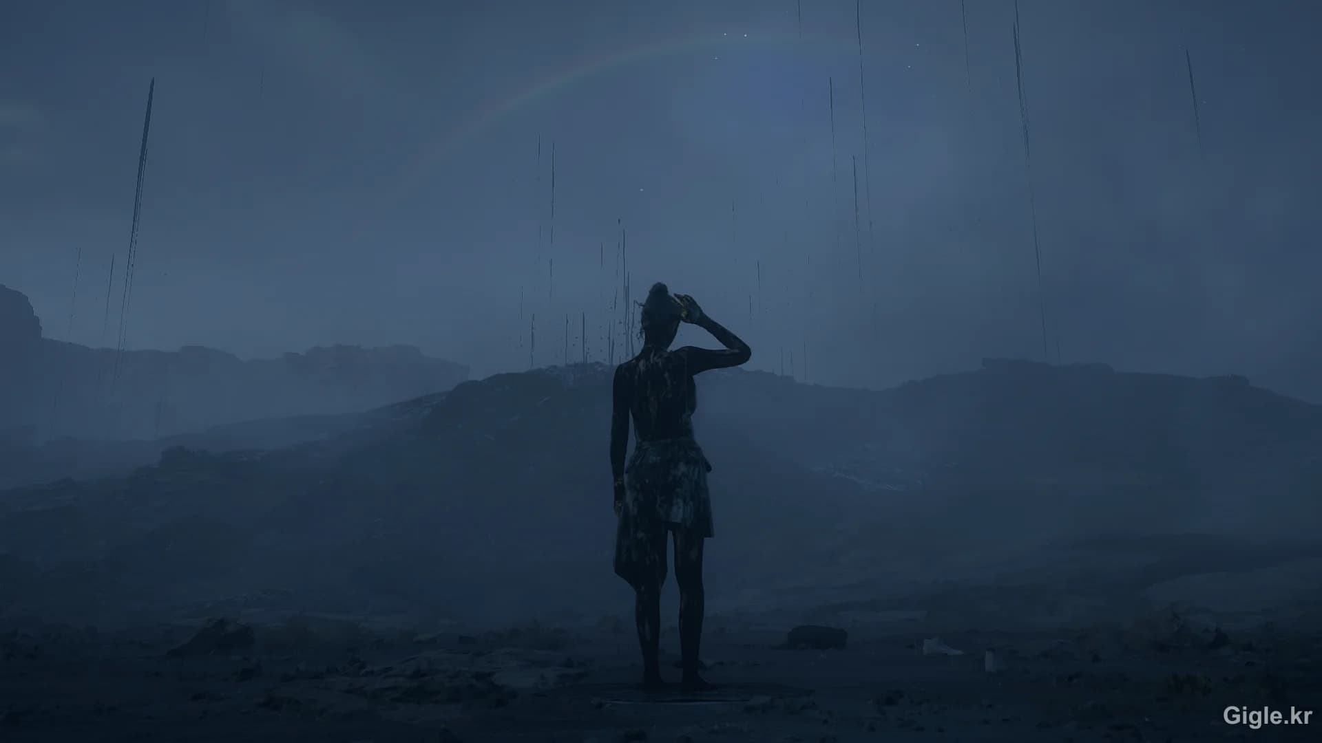 데스 스트랜딩 2 황량한 대지 끝 무지개를 바라보는 뒷모습